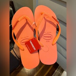 Never-been-worn, coral Havaianas with sparkles